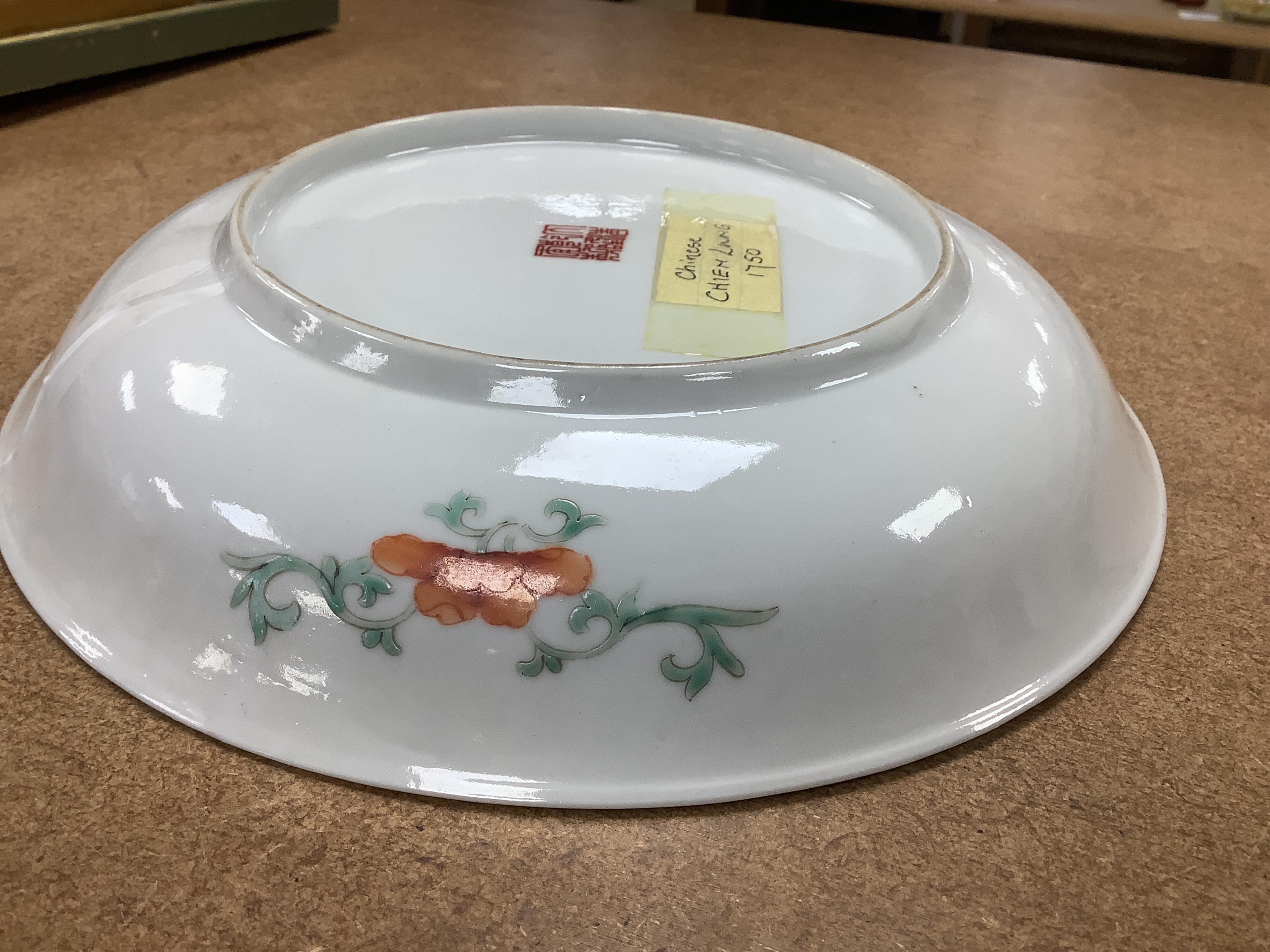 A Chinese enamelled porcelain millefleur dish, Qianlong mark, early 20th century, 24cm diameter. Condition - good